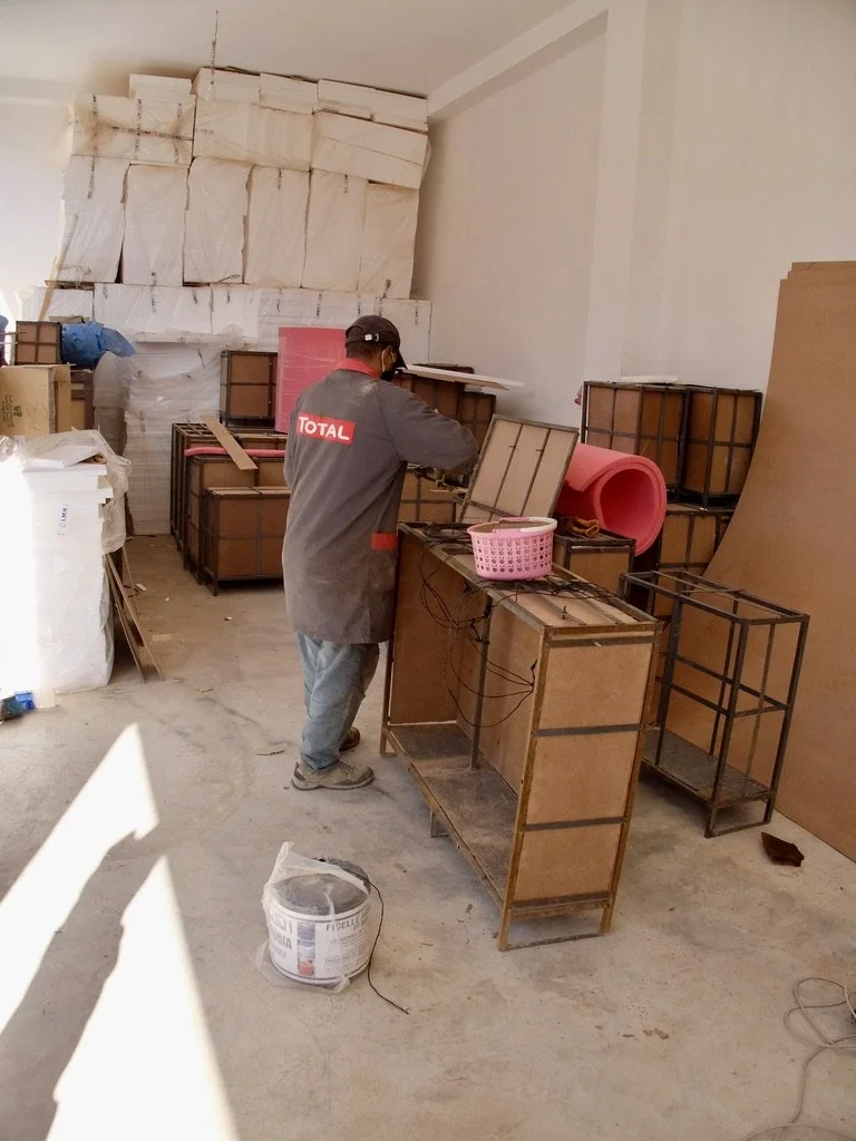   Mezane Fossil Factory, Rissani.   He’s building boxes for shipment of fossils worldwide. 