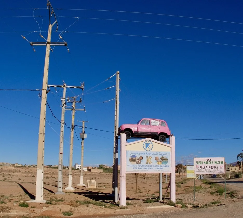  The same hotel owner whose hotel we saw before with a car in front.  This time the car is pink, for Kelâat M'Gouna. 