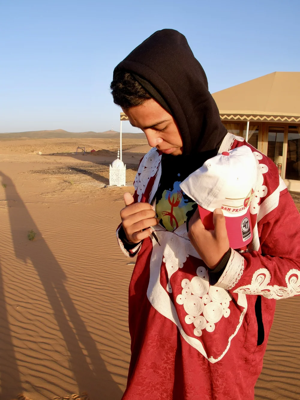 Explaining his T shirt.