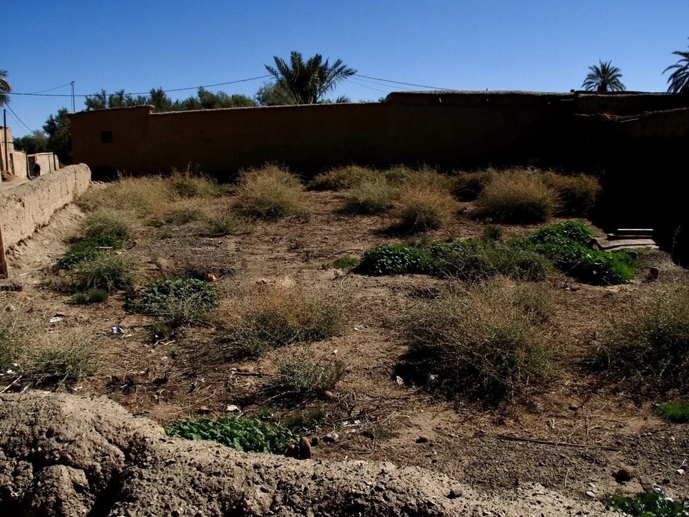  A cemetery.   Corpses are wound in a shroud &amp; buried on their right side with the head facing Mecca. 