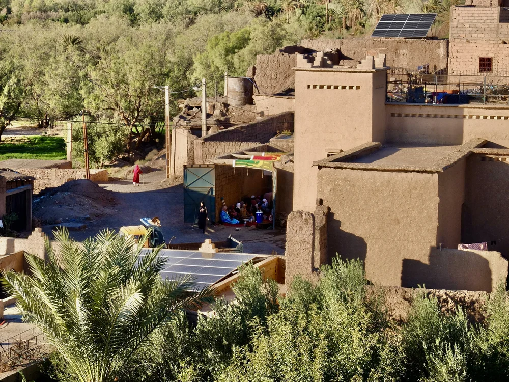  From the rooftop of Ksar El Kabbaba.  The muezzin had announced that morning about the death of someone in the community. In the center of the photo you can see folks gathered in the home of the deceased paying their respects.     