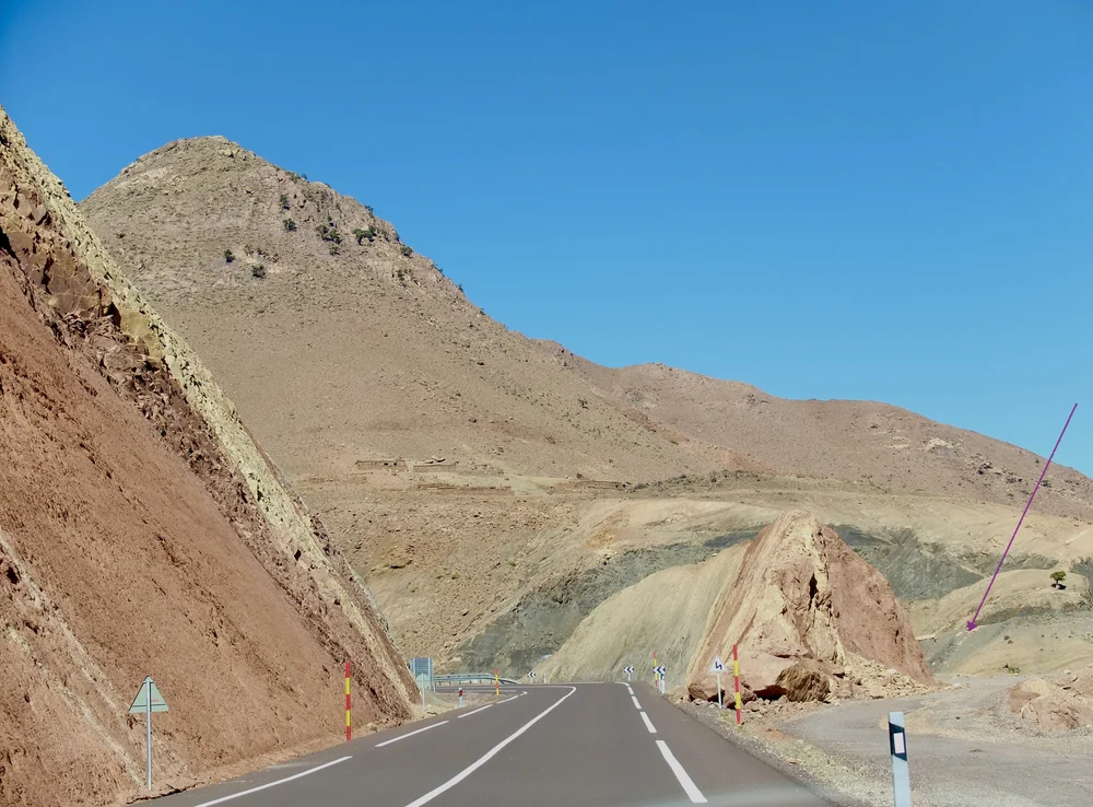  N 9 has recently been improved. Note the arrow pointing to the old road.  Farid said he had driven on N9 during the construction. Sometimes he would be stopped for a while &amp; then hear &amp; feel a nearby dynamite explosion &amp; then continue on