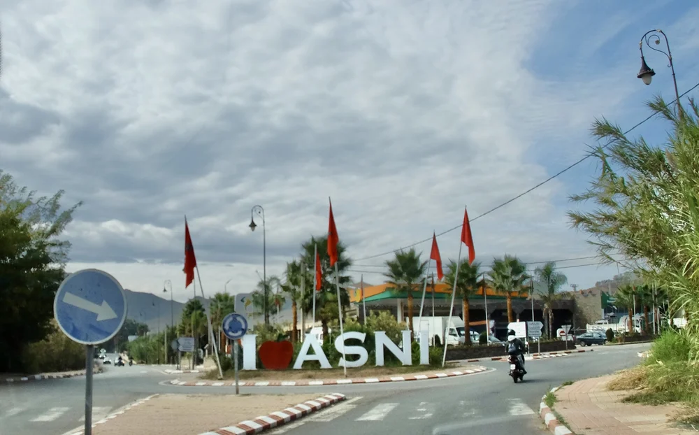  Asni, a centuries old village of about 25,000 people, is known for its agricultural productivity, especially apples.  Ninety-percent of houses in Asni were destroyed during the 6.8–6.9 September  2023 Marrakech-Safi earthquake.    