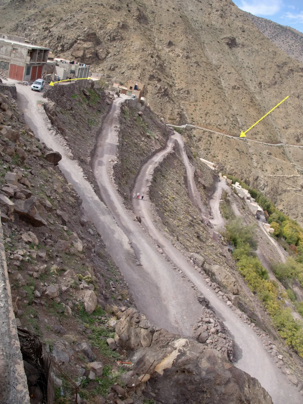  We were on this road, right arrow in the previous photos. It’s about where the donkey was going down in an earlier photo.  Badu parked the Toyota at the left arrow &amp; we… 