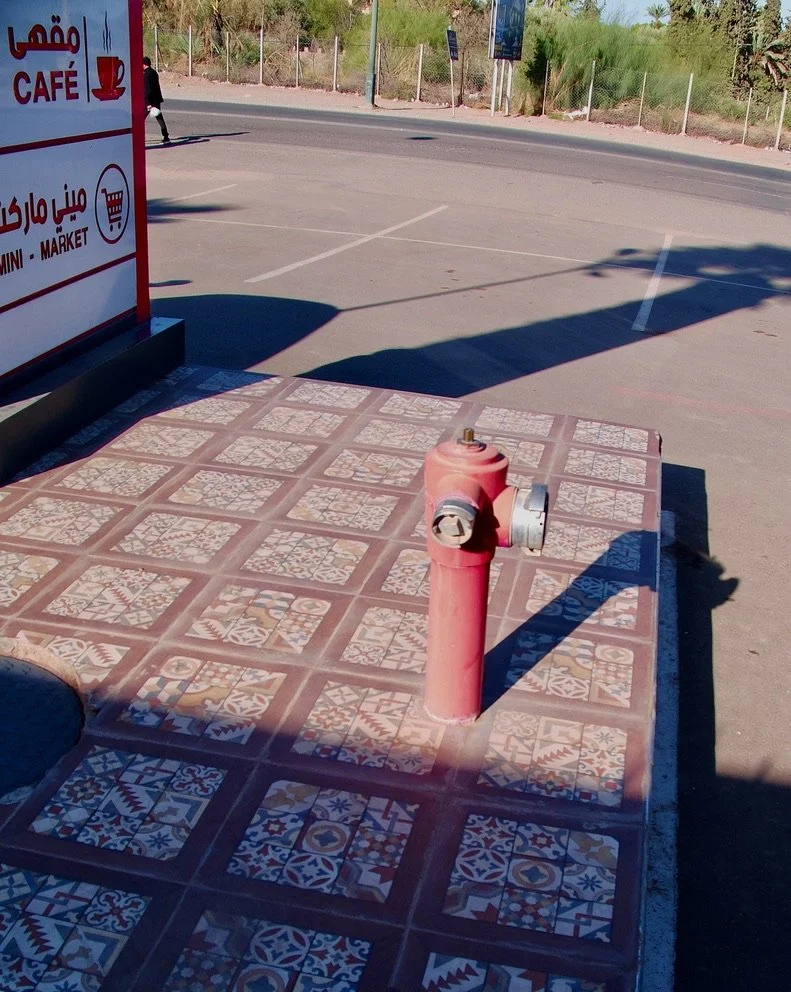  You gotta love a fire hydrant in such a lovely sidewalk. At a Friskiss restaurant.   
