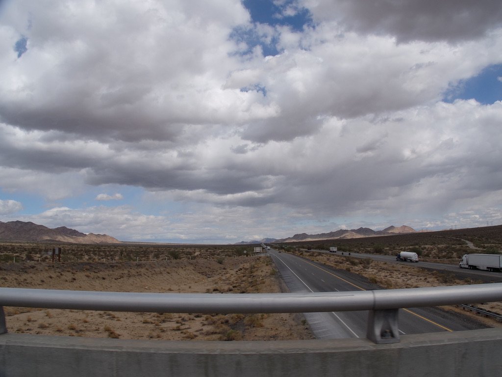 US 10 overpass to the Park’s Cottonwood entrance & the Pinto Basin Road. On the left are the Eagle Mountains within JTNP. The Salton Sea is way over to the right.