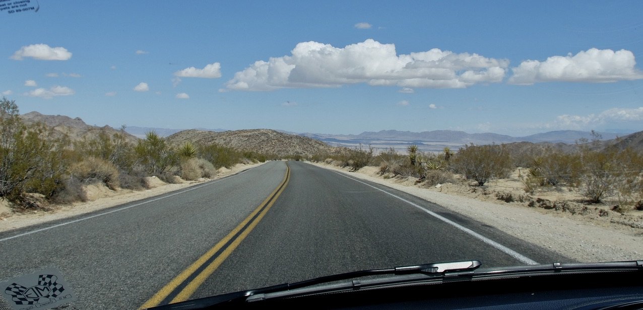 Approaching the North Exit Station of JTNP on Park Blvd. In the distance the city of 29 Palms, Copper Mountain & the Marine Corps Air Ground Combat Center 29 Palms.