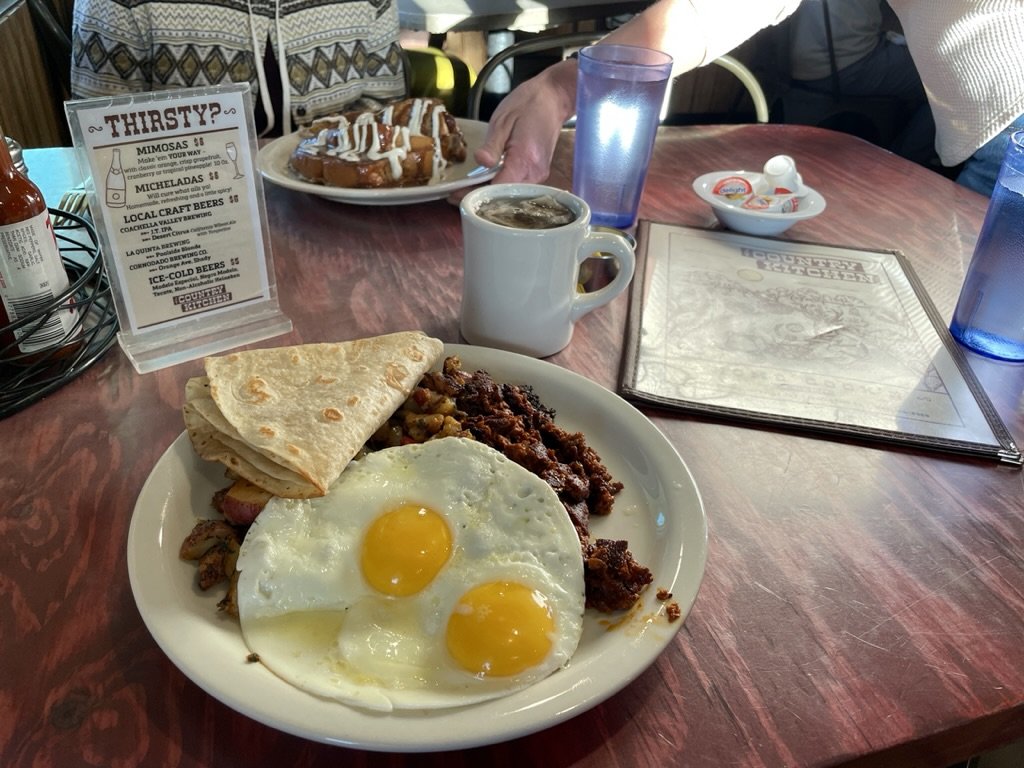 JT Country Kitchen. Country Breakfast w/ soyrizo & Cinnamon Swirl French Toast dipped in vanilla-cinnamon butter.