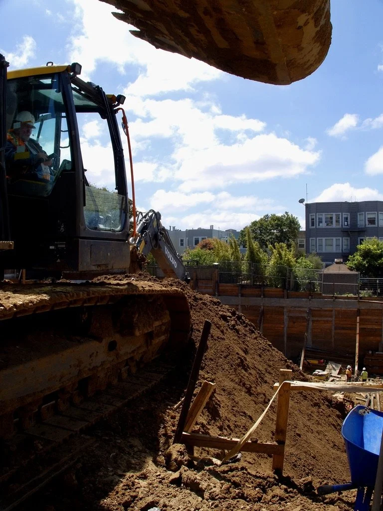  A deep excavation to be parking, above it storefronts &amp; above that residences. It will be the same height as surrounding structures; three stories. 
