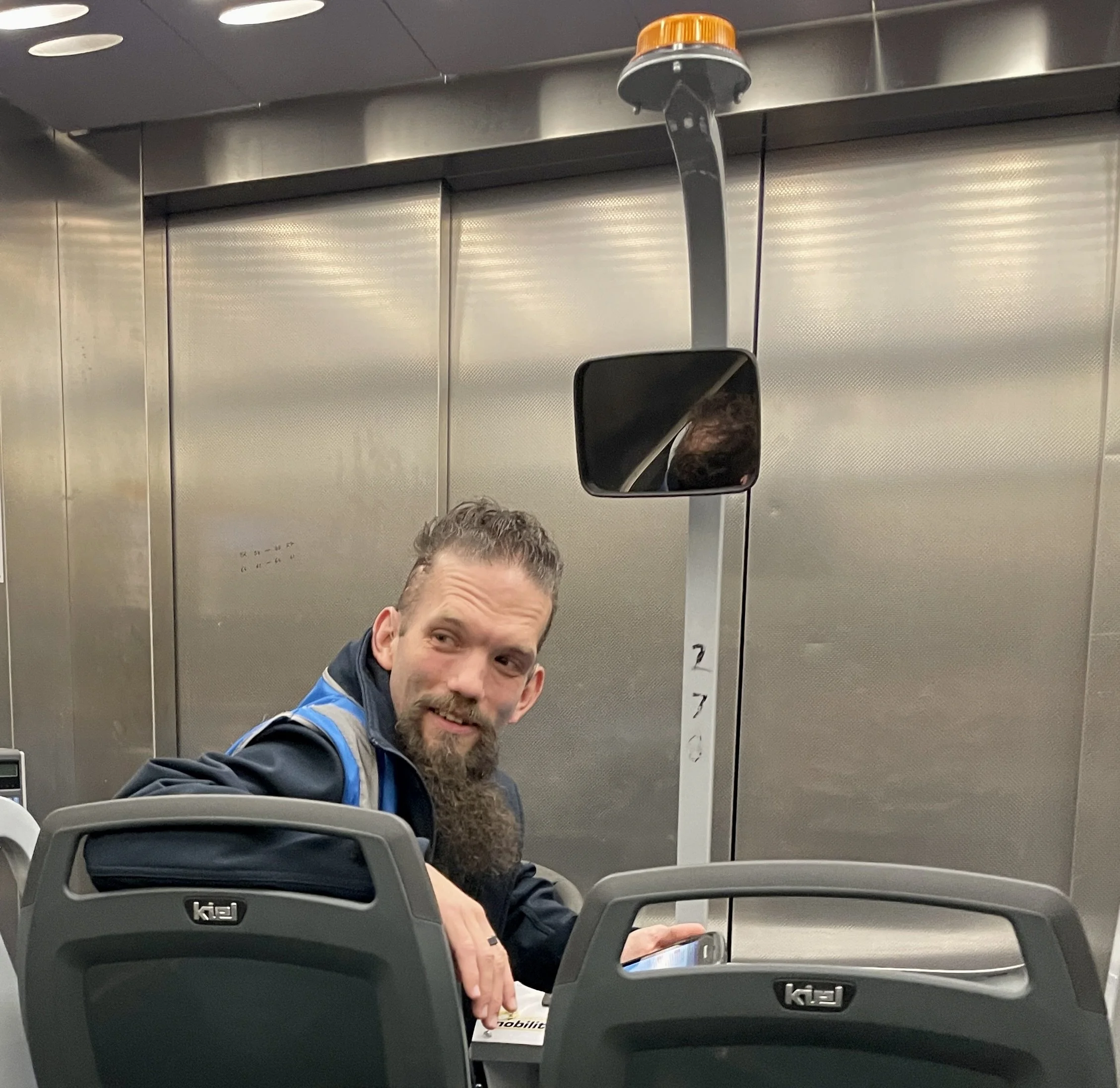 At Heathrow (LHR) Internat'l Airport, Ken pushed me for a long stretch in a wheelchair.  We then took a ride &amp; then another wheelchair excursion.  He was a lovely family guy.