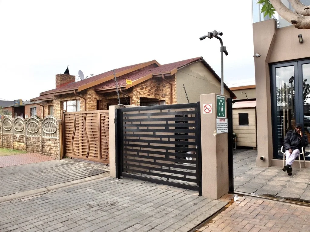   Vilakazi Street. Many establishments in Joburg had guards by the door. 