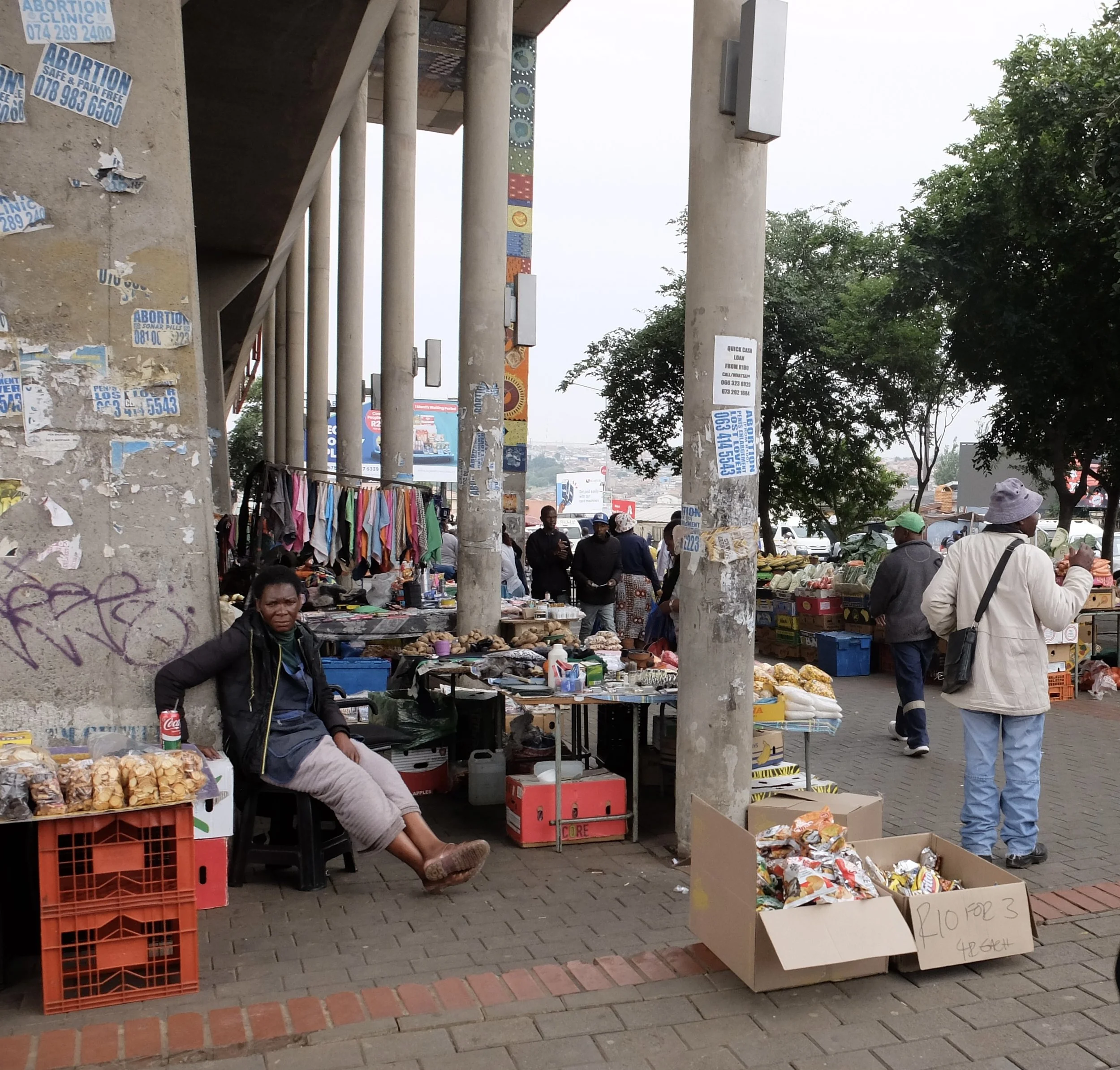  Read the posters.  Soweto, Joburg, ZA. 