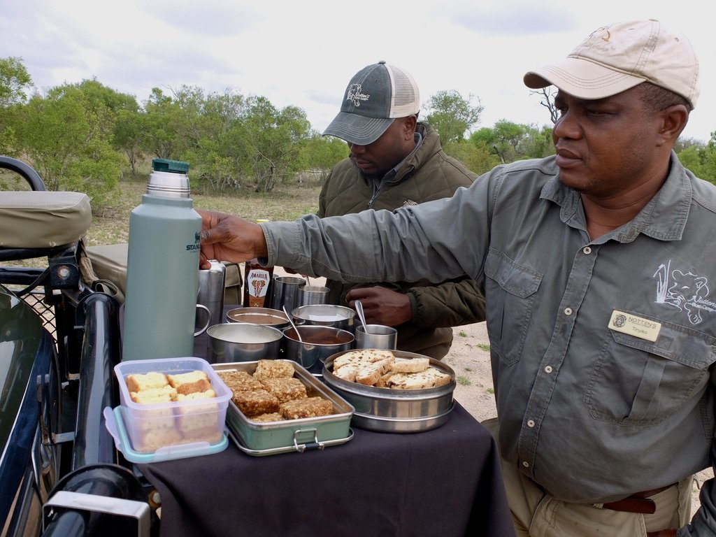  At about 6:30-7:00, midway through the game drive we paused for tea or coffee, infused with Amarula Cream &amp; rusks to dip. Rusks are a super hard biscotti that when dipped in your drink filled you up until a full breakfast at 8:30AM.  “Amarula is