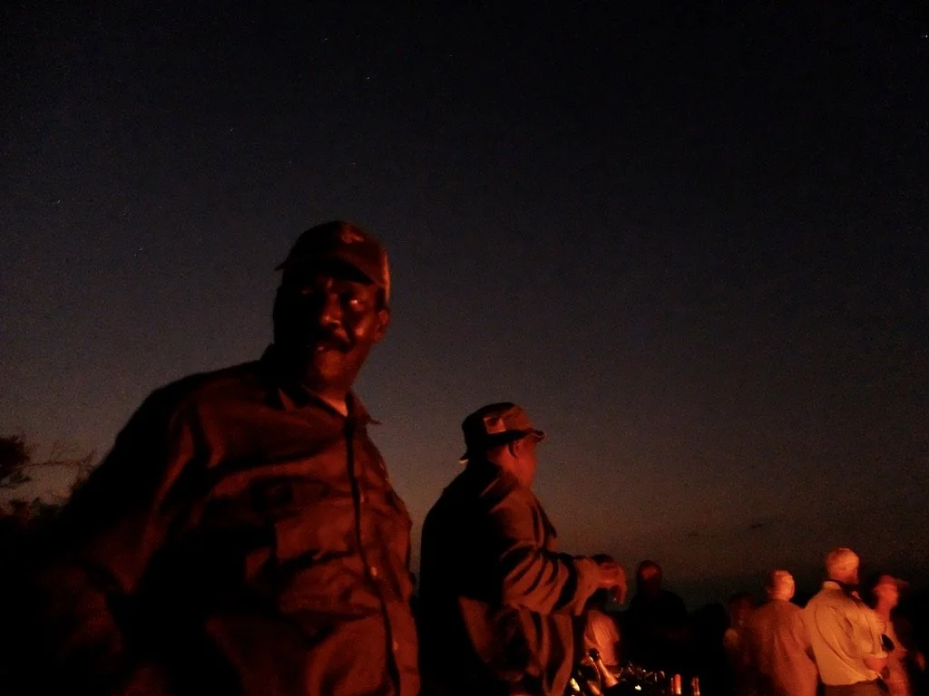 Joseph, who’s worked at Notten’s for 46 years &amp; has trained innumerable guides, gave us a fireside presentation of animal calls.  In my head was Paul Simon singing  "Joseph's face was as black as the night   And the pale yellow moon shone in his