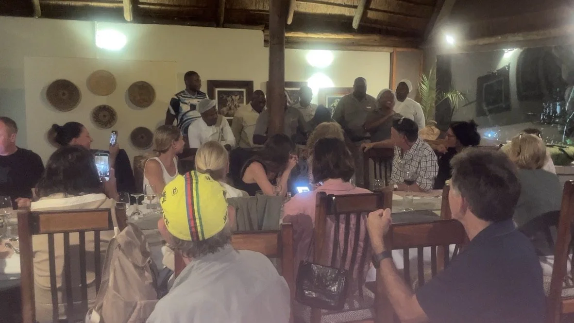  The shirt worn on the left has the colors of Botswana’s flag.  Black for the black people, white for the white people &amp; blue for the sky.  Muchenje Safari Lodge, Chobi River, Kasane, Botswana. 