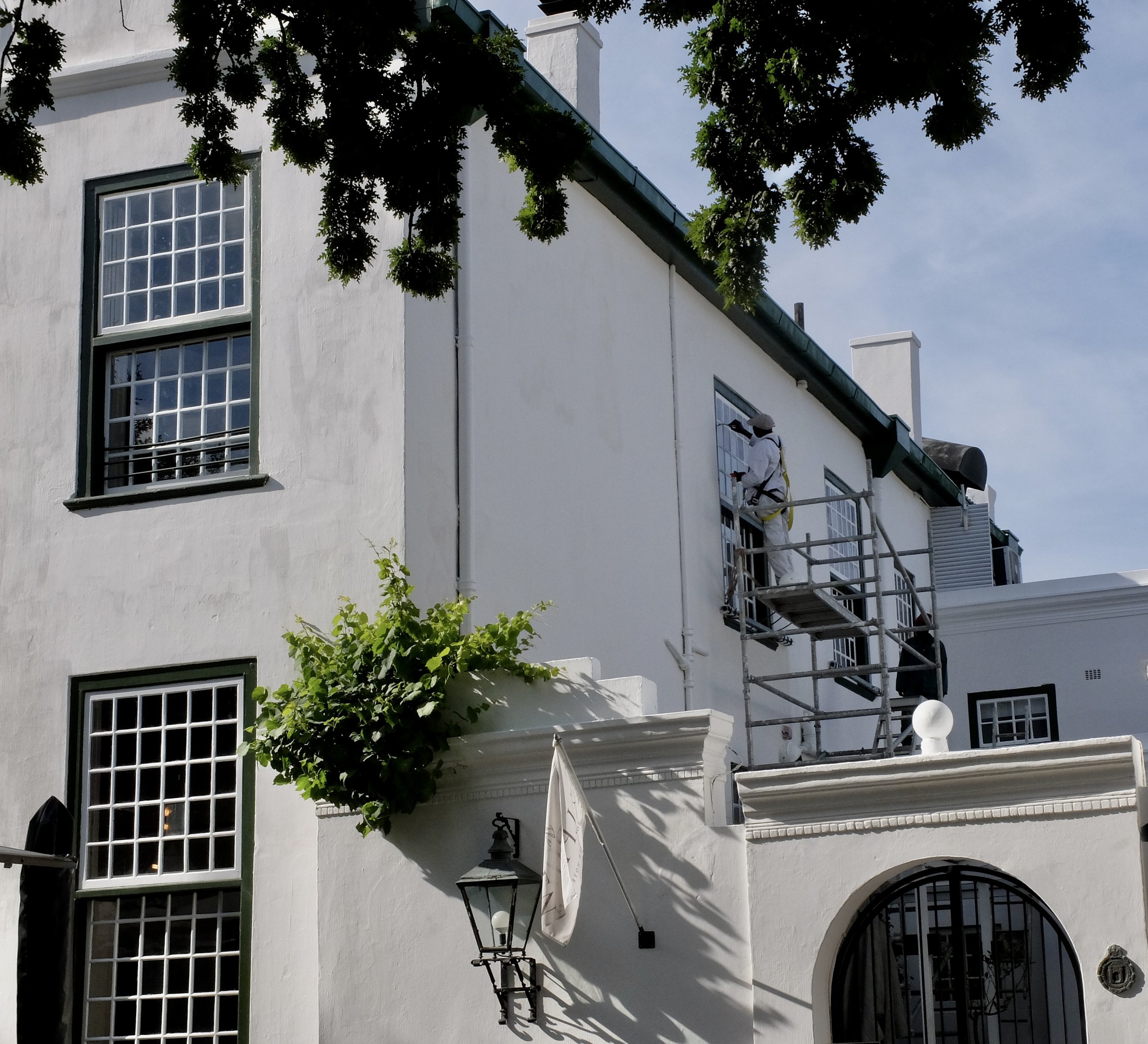  He’s got an awful lot of detailed painting to do.  “Cape Dutch architecture is indigenous to South Africa. Dutch colonists took the Dutch architectural fashions of the 17th century…and adapted it for the Cape climate. For example…small-paned shutter