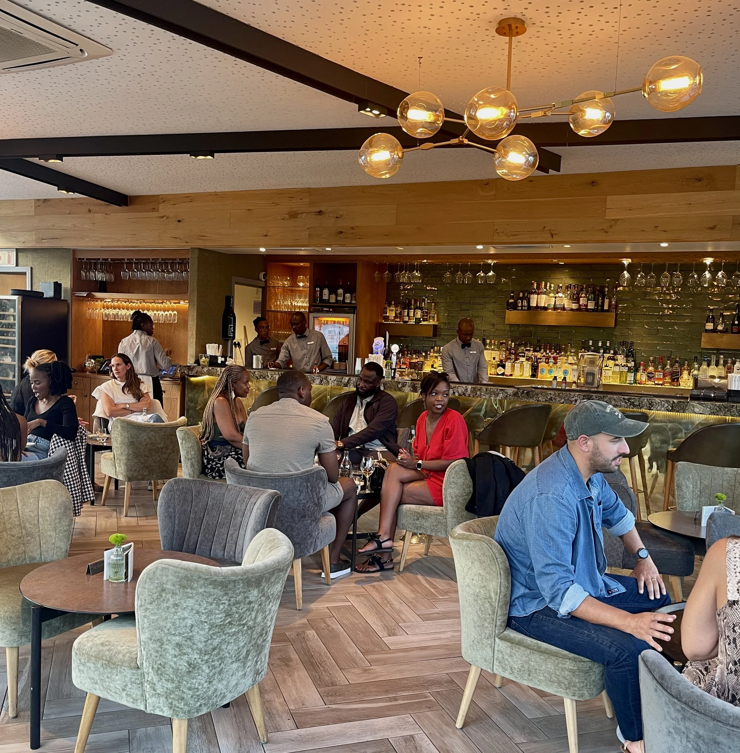  INCOGNITO in the Alphen Boutique Hotel, Cape Town, South Africa.  A mere 33 years ago this scene of black &amp; white folks eating together would  have been illegal.   Photo by Nomi.   