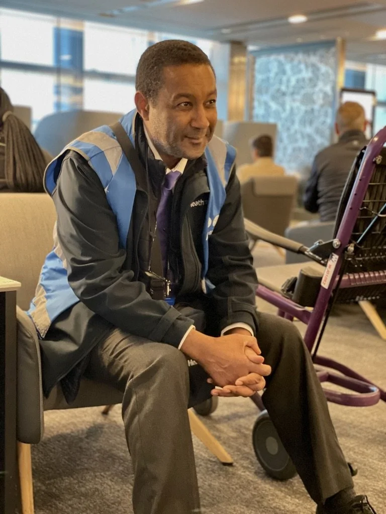  Luis at LHR - Healthrow Internat'l Airport.  He pushed us past many a long line &amp; then had time to spend with us.  Luis worked for many years as a pastry chef &amp; created the recipe for the scones that were available in the lounge.  