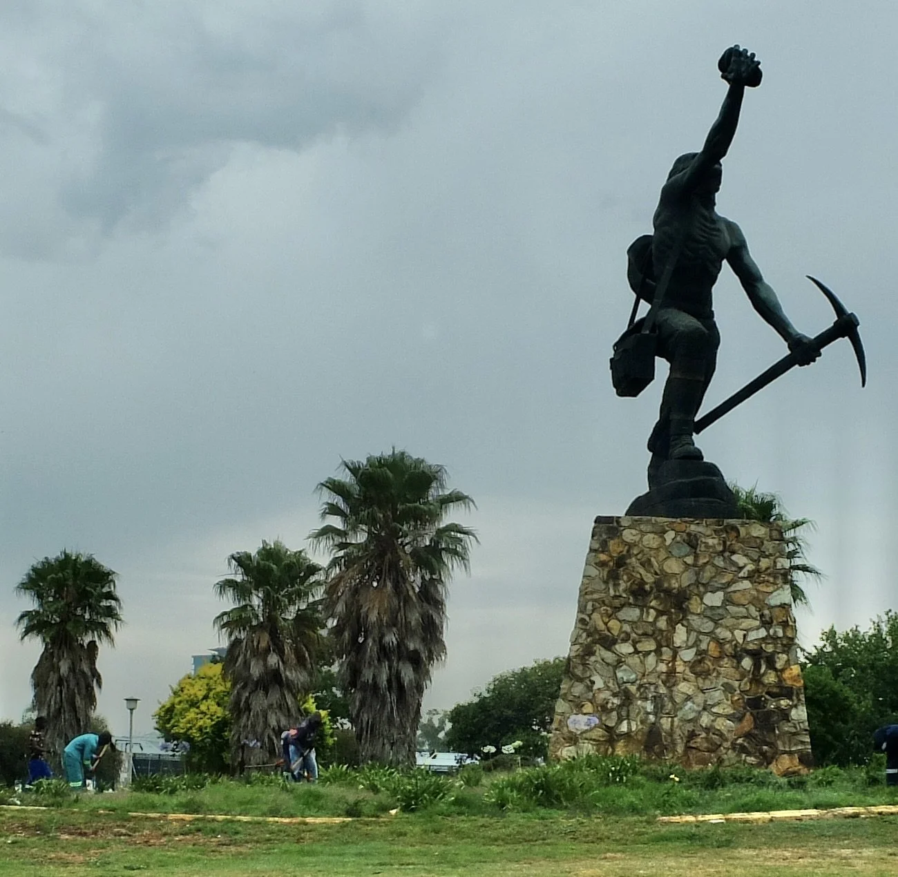  This statue of George Harrison commemorates the 1853 discovery of gold in Joburg. The Joburg area is at about 6,000 feet &amp; was just flat desolate  savannah before the discovery of gold.  Joburg, ZA. 