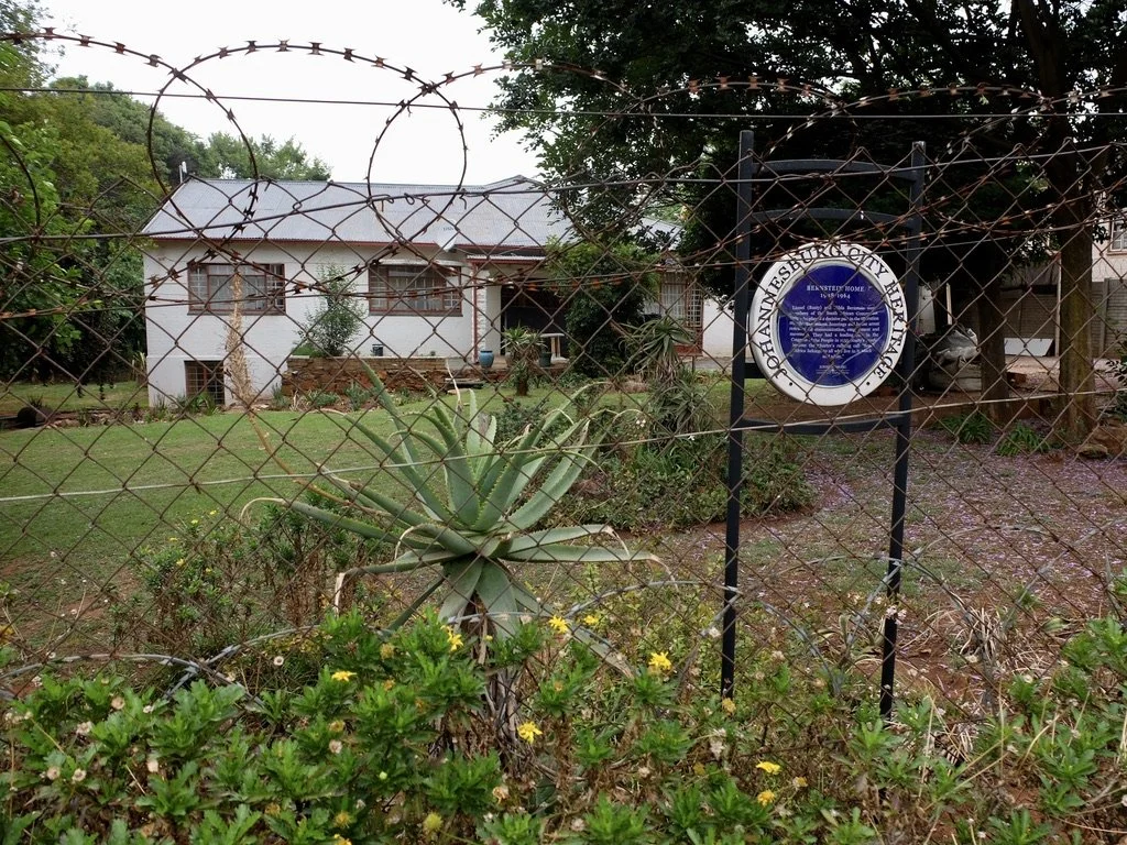  The home of anti-apartheid activists, Hilda &amp; Rusty Bernstein.  Hilda’s memoir,  The World That Was Ours  educated us on the horrors of the apartheid system.  In the book she gave the address of their home.  Our driver Jacob found it.  