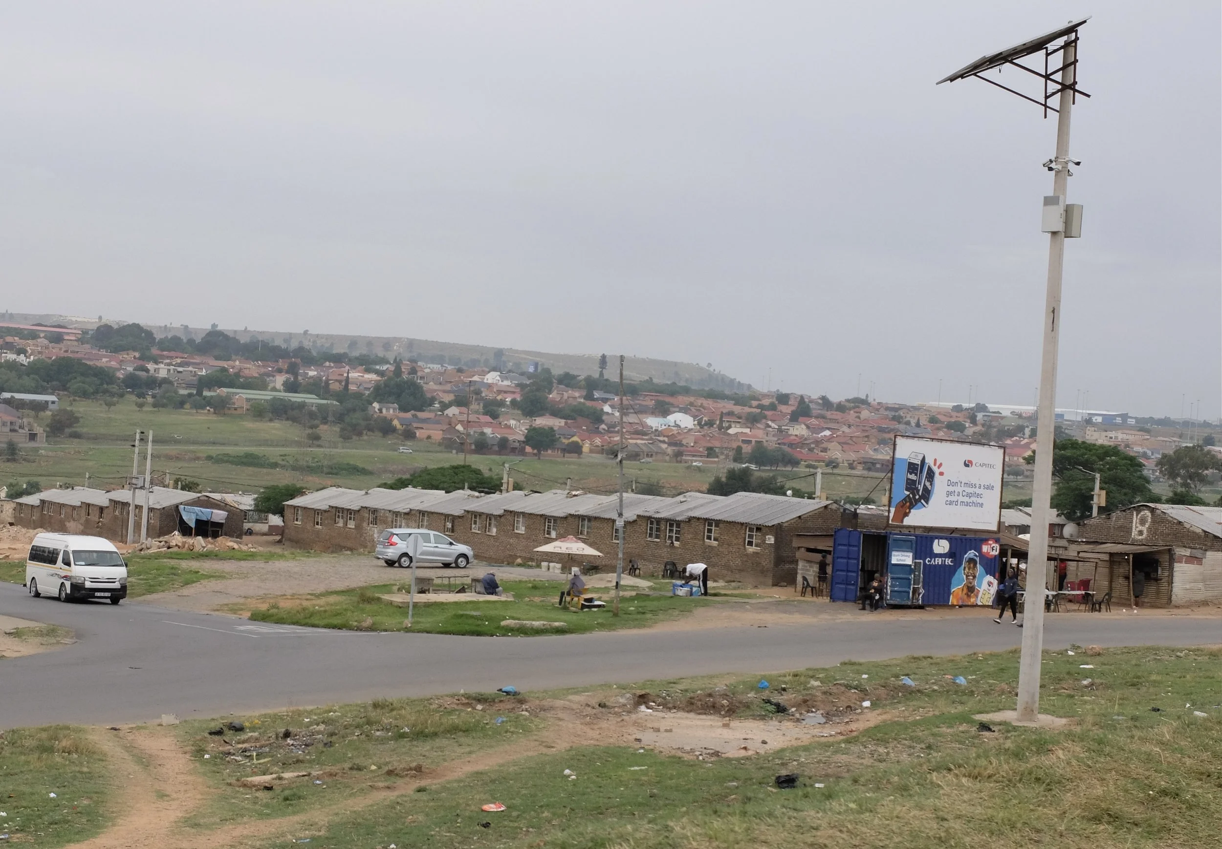  Hilda Bernstein wrote about these communal housings for single black men.  Showers, toilets, eating &amp; sleeping were communal.  It sounded awful.  Joburg, ZA. 