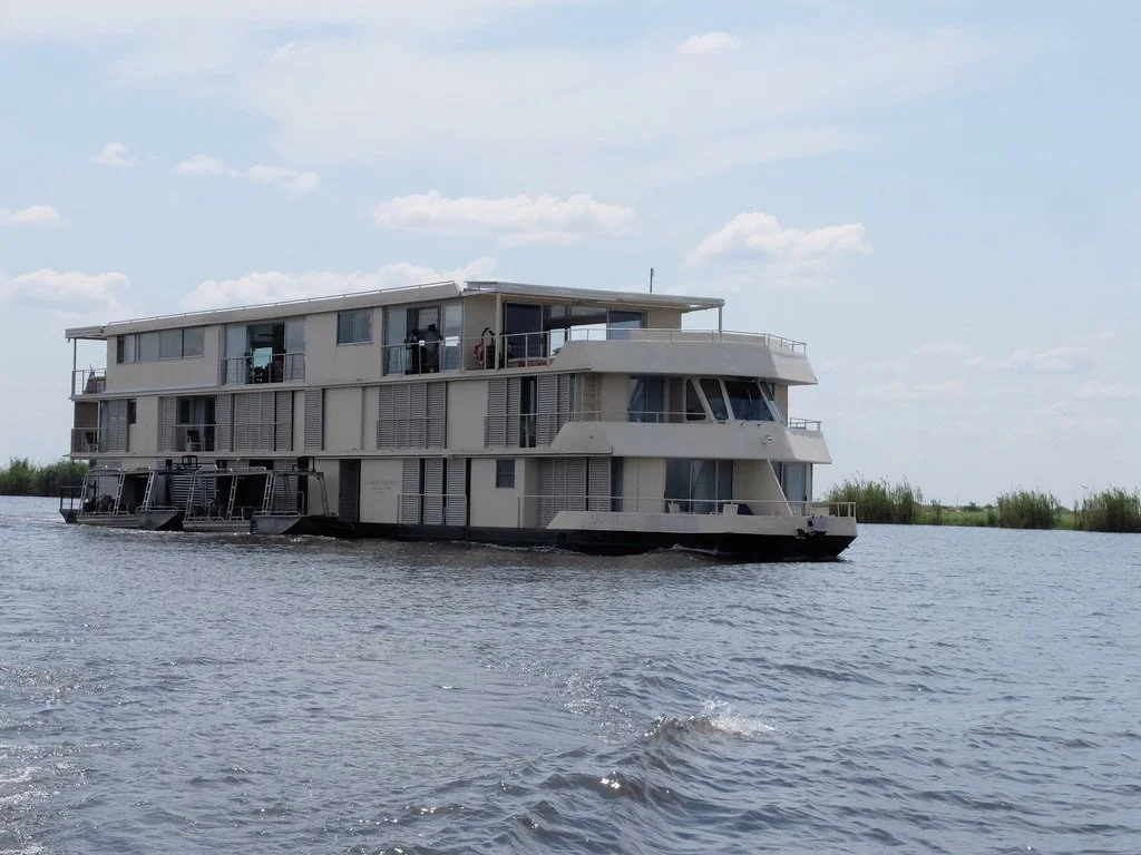  One can take a luxurious river cruise &amp; step right outside of your cabin into the crocodile infested river.  Chobi River, Chobe Nat’l Park, Botswana with Namibia across the water. 