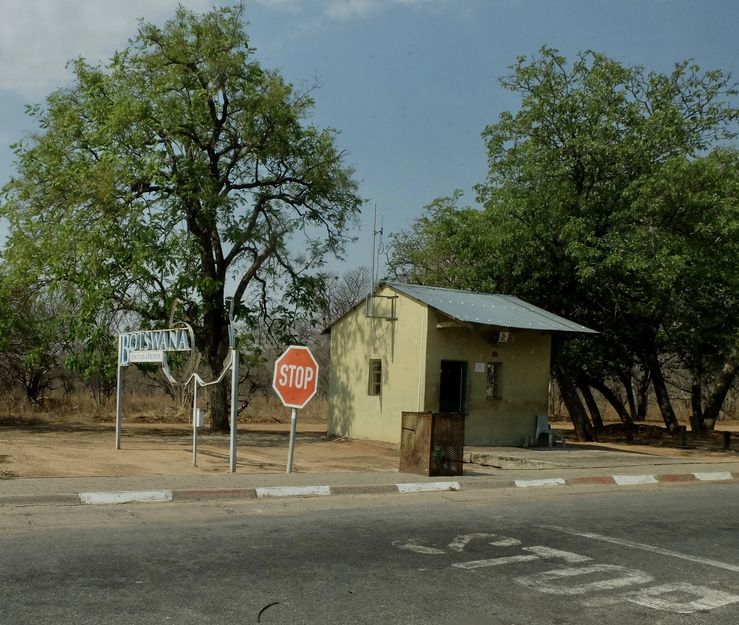  This was our first introduction to baboons with whom we would be having a continuing relationship all the way down to almost the tip of Africa.    Shortly after the sign “Botswana - United &amp; Proud” was installed, a troop of baboons tried to rip 