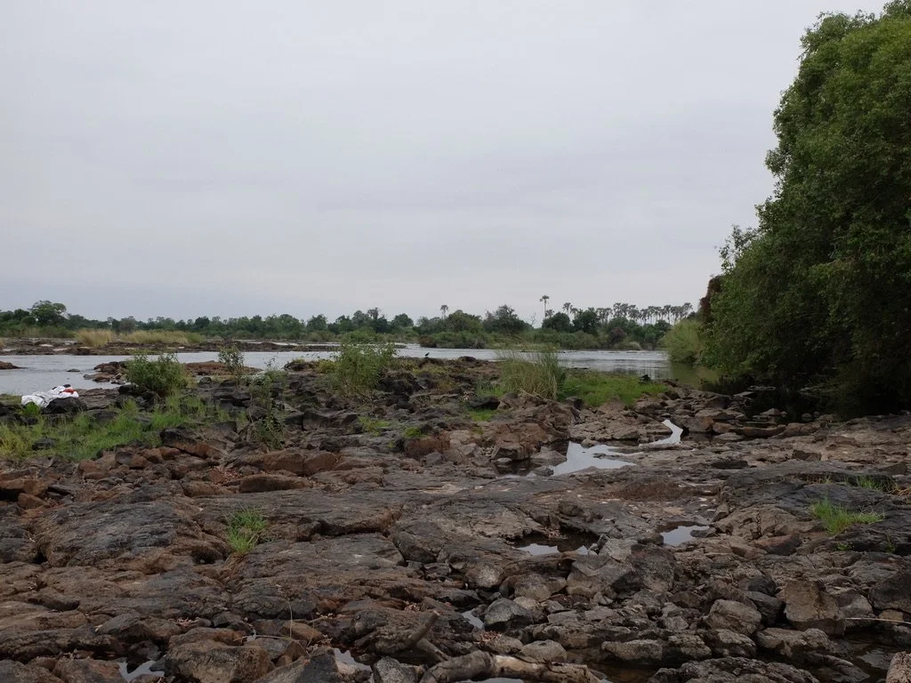  Photo from Zambia by Nomi of the Zambezi River flowing into the falls. Zimbabwe on the other side of the river. The Devil’s Pool is to the left; note the towels folks left behind. 