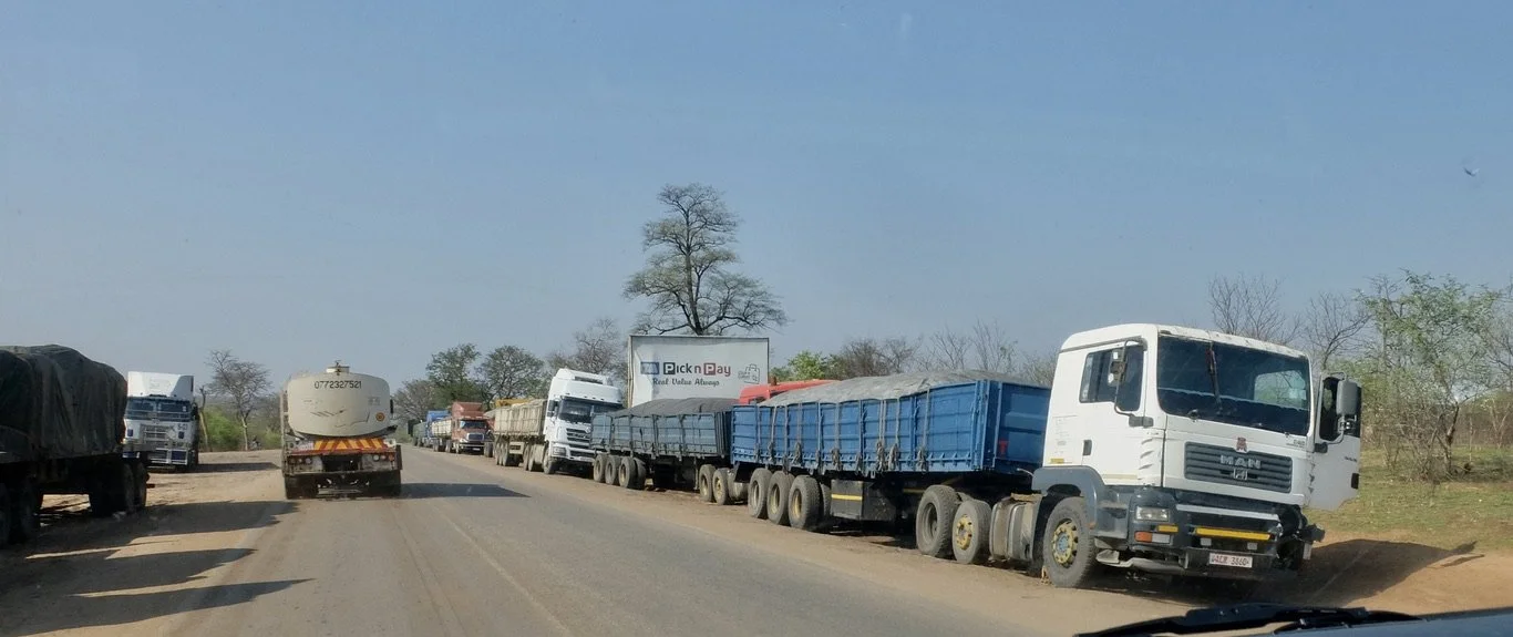  On Zimbabwe A3 to the Victoria Falls International Airport.  These trucks were waiting to cross into Zambia.   They could be waiting for days. 