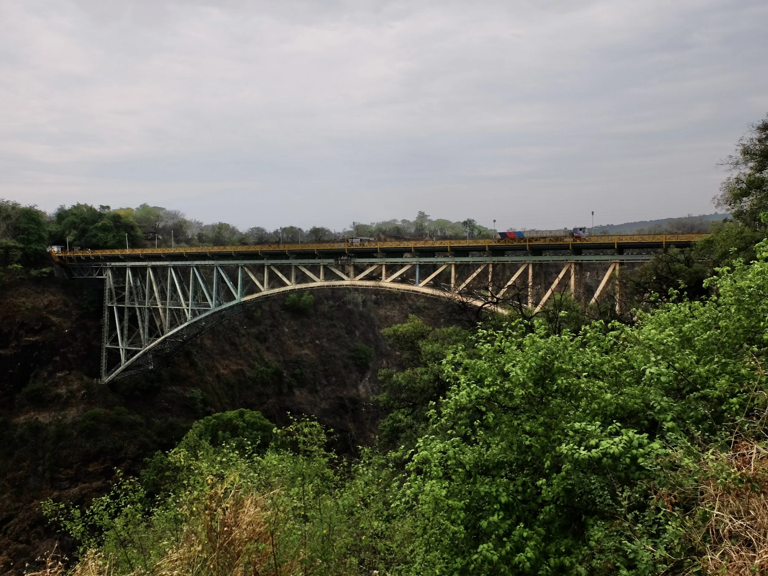  Truck crossing the Victoria Falls Bridge into Zambia.  The bridge was made &amp; assembled in sections in England &amp; shipped via ship &amp; rail to the gorge.  Assembly was completed on April 1, 1905.   For the bridge geeks, this is most interest