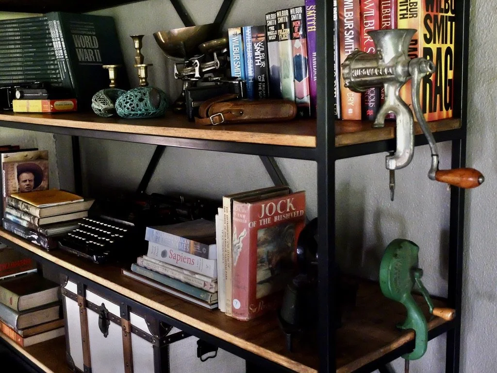  I was intrigued by the collection of Wilbur Smith books.  He was “…a Northern Rhodesian-born British-South African novelist specializing in historical fiction about international involvement in Southern Africa across four centuries.”  I just bought 