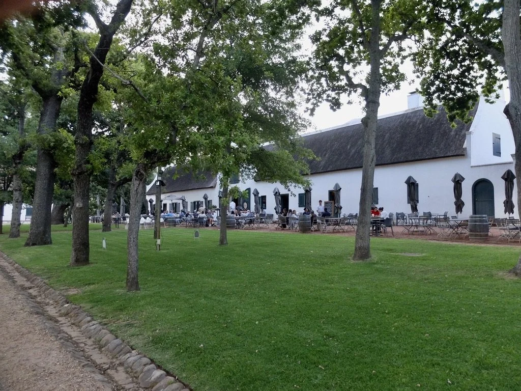  Jonkershuis Eatery @ Groot Constantia Wine Farm.  “Cape Dutch architecture, originating in the 17th and 18th centuries in the Dutch-established Cape Colony, this architectural style became a prominent symbol of power, status, and identity…. Whitewas