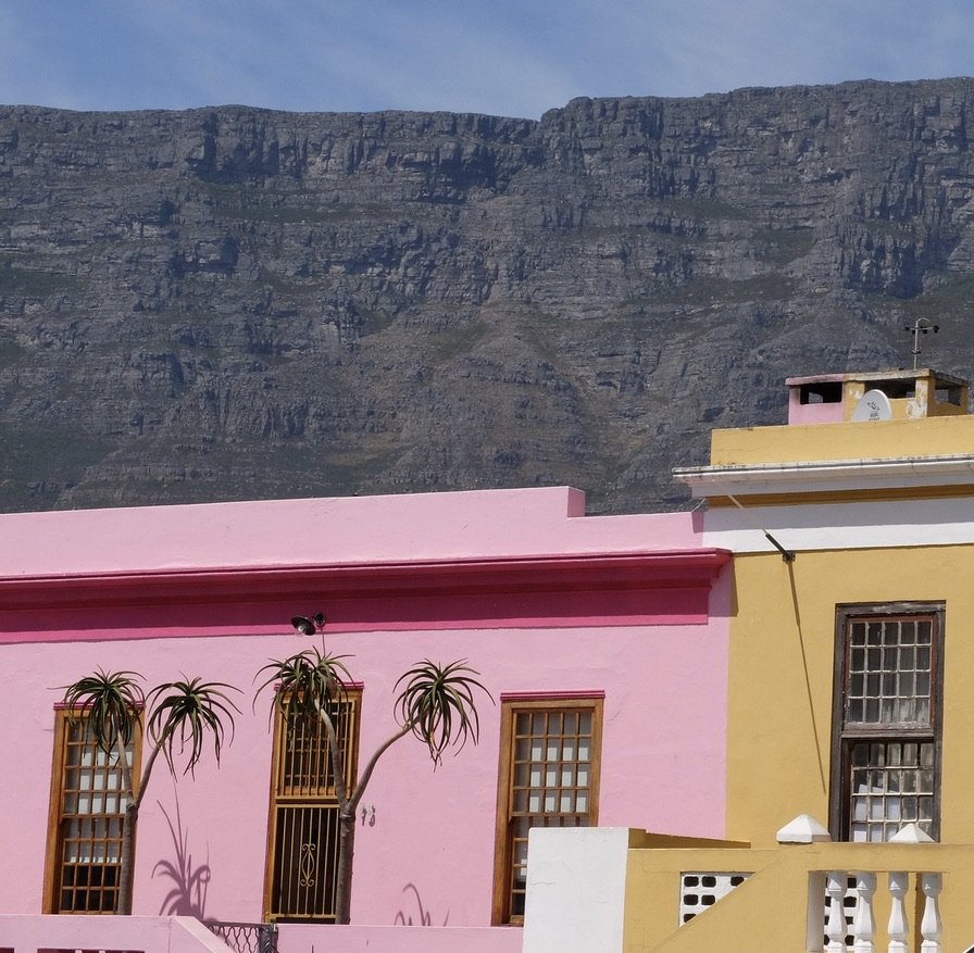   The Bo-Kaap“…is a former  racially segregated area, situated on the slopes  of  Signal Hill above the  city centre and is a historical centre of  Cape Malay culture i n Cape Town.”  Cape Town Eats Tour with Karin Schmidt. 