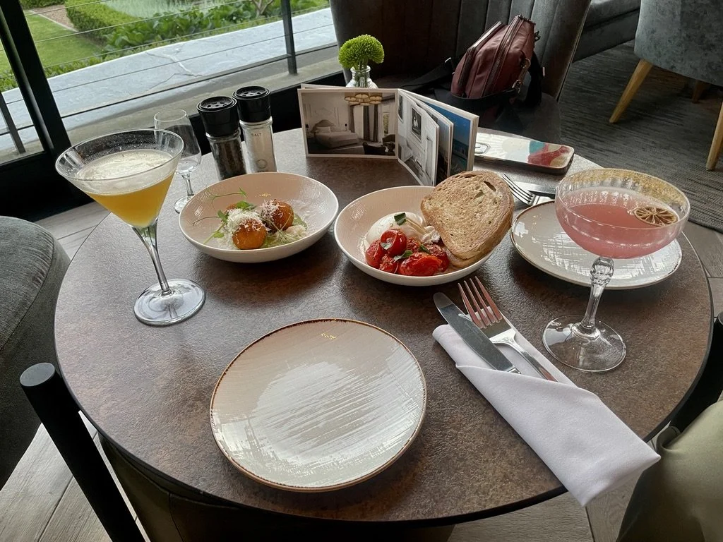  “Unwind  (after a long day’s drive ) at Incognito, the ( Alphen ) hotel's stylish cocktail and tapas bar and restaurant.”  ANKRAH MARTINI - Grey Goose Vodka, Martini Prosecco, Passion Fruit. Pineapple, Vanilla   MARGARITA - Jose CuervoTradional Silv