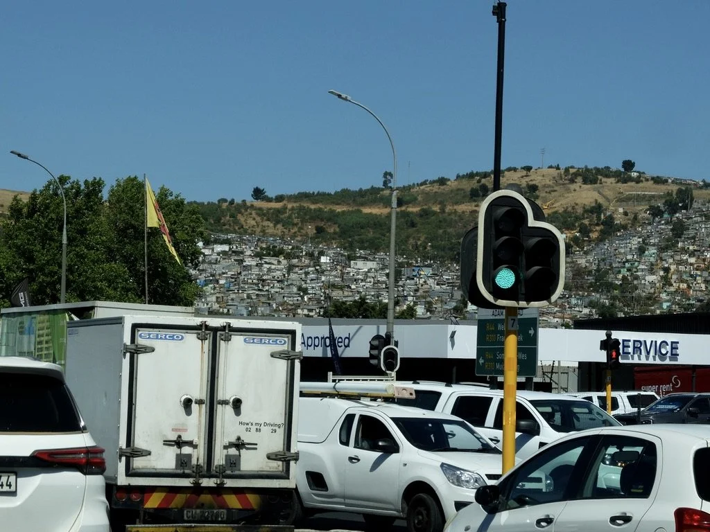  En route to Stellenbosch we noticed where most of the workers lived up the hill. 
