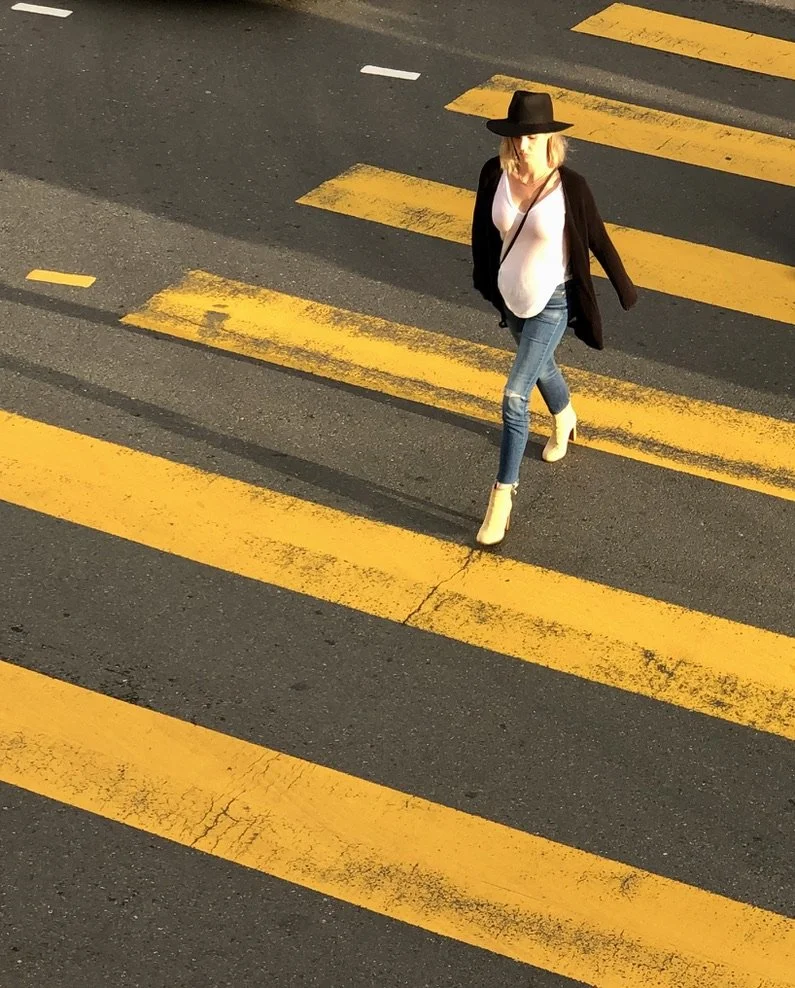  Gazing out from the SF Jazz building balcony, I was entranced by the yellow diagonals of the crosswalk &amp; then she entered the frame…  Oh, shoes again. iPhone 