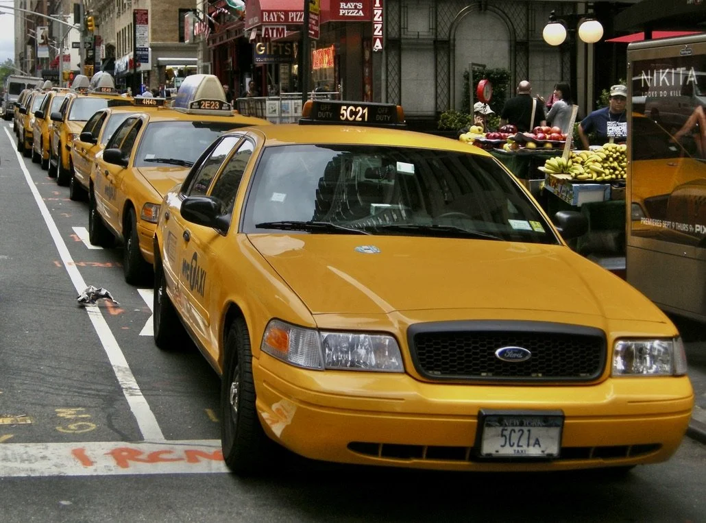  NY, NY.  Taxi drivers lined up for a food break. 