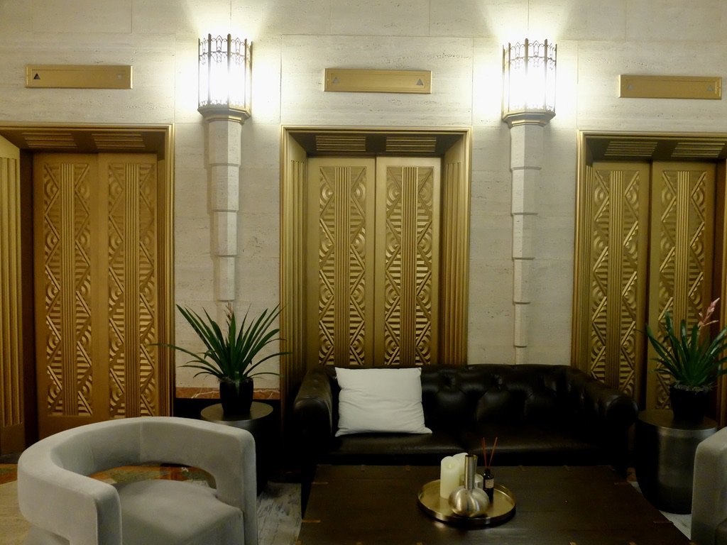  1929 elevators no longer in use have been replaced with “new destination dispatch elevators.” 