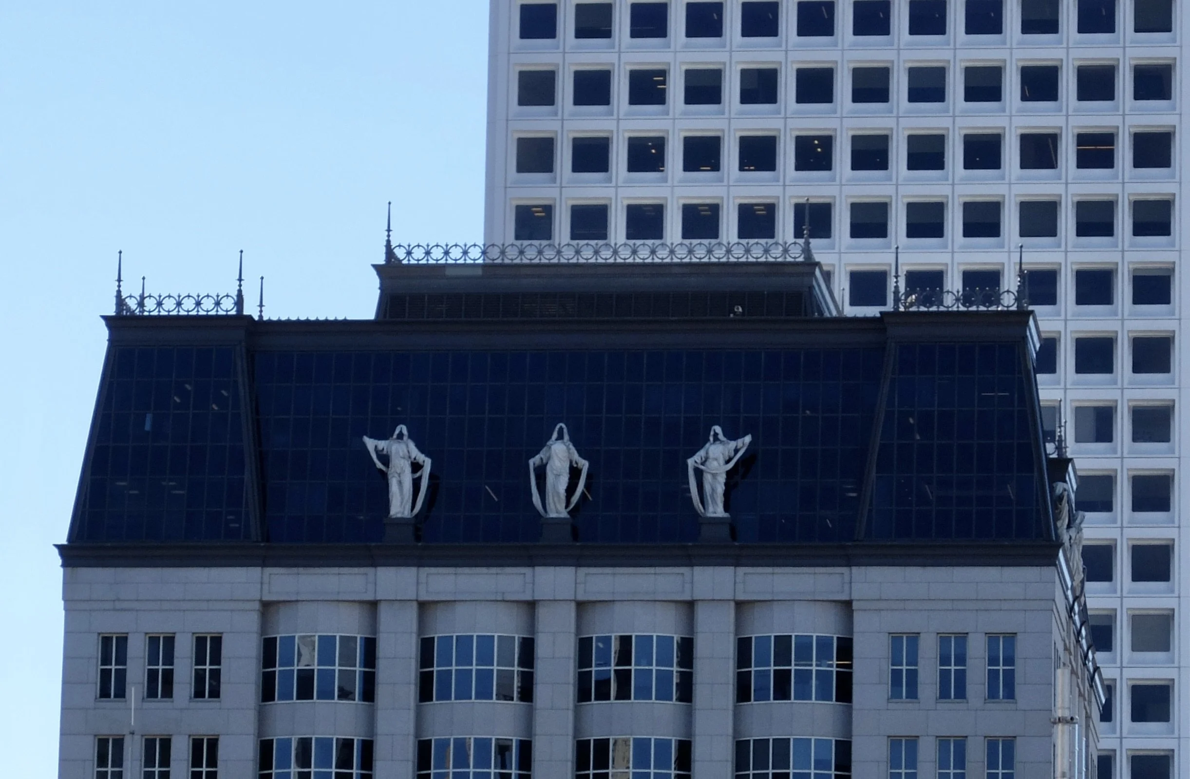  When on the rooftop, I turned around &amp; was surprised to see those rooftop statues on a neighboring building. 