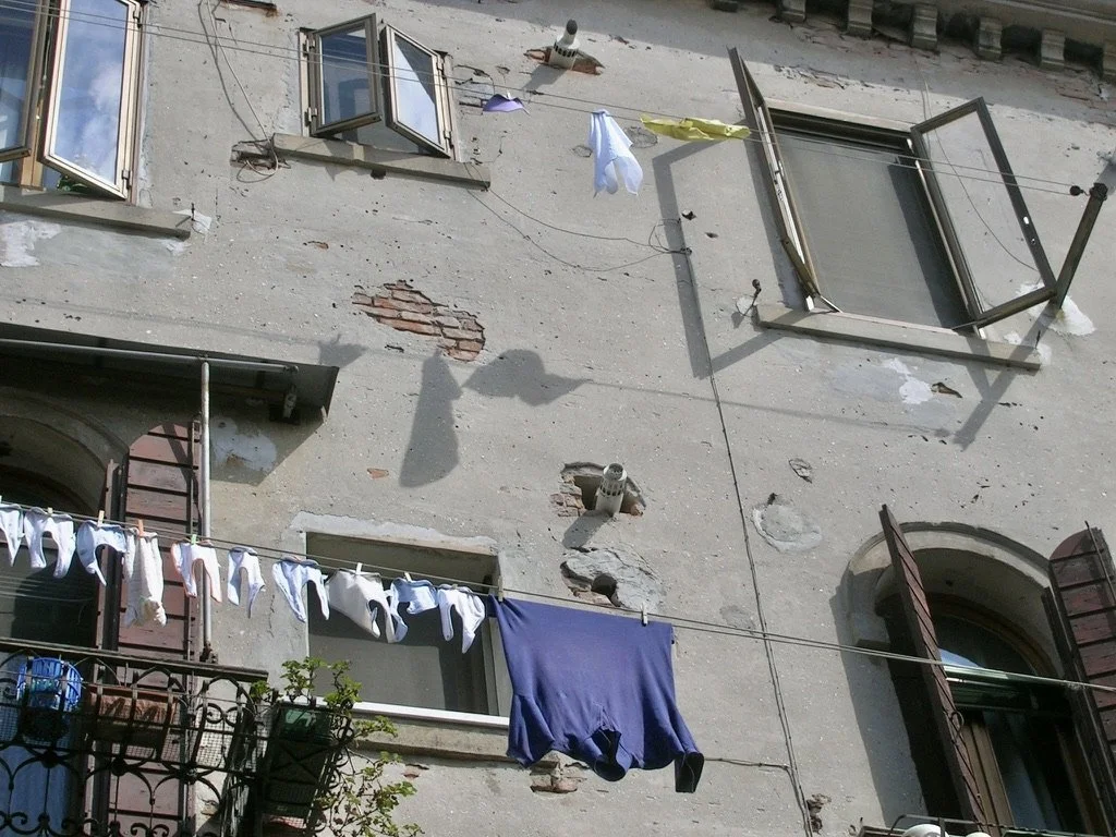  Venice, Italy. May 2007.  Drain pipes coming out of the wall. 