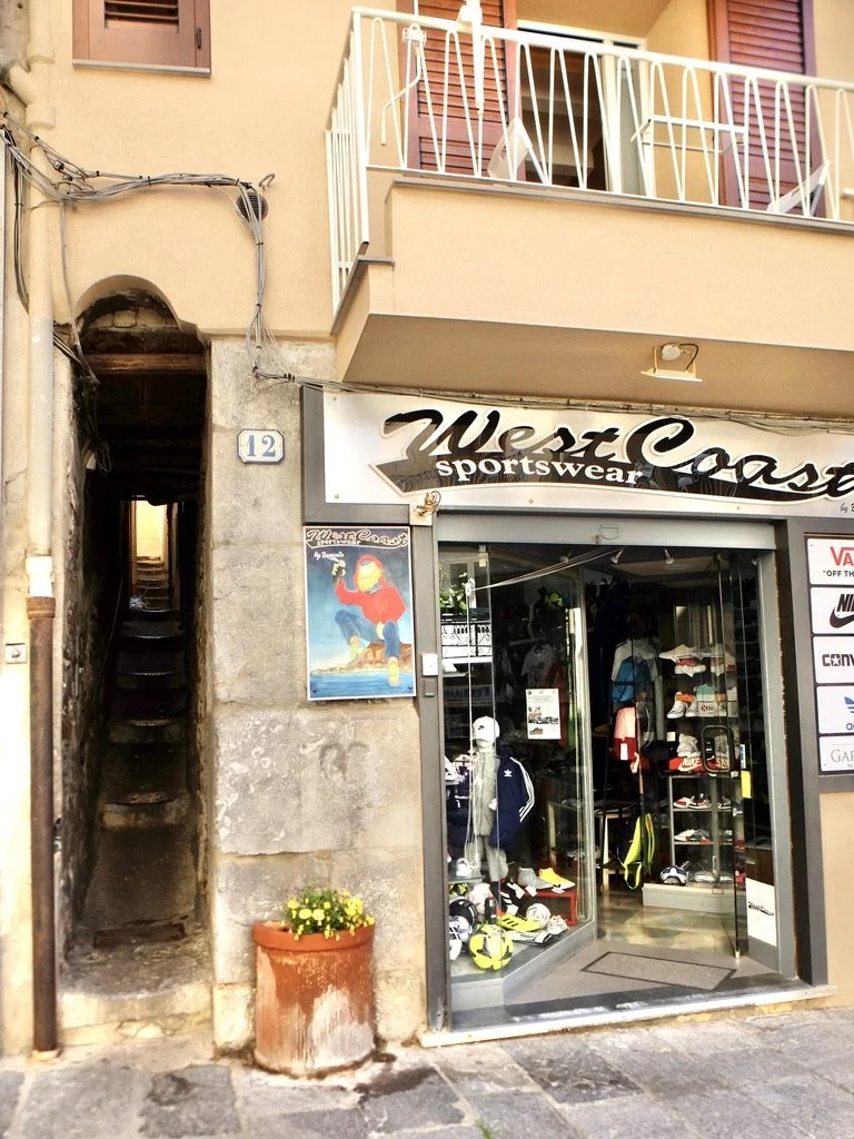  Nice that the drainpipe enters into the sidewalk.  Cittá di Cefalù, Sicily. 