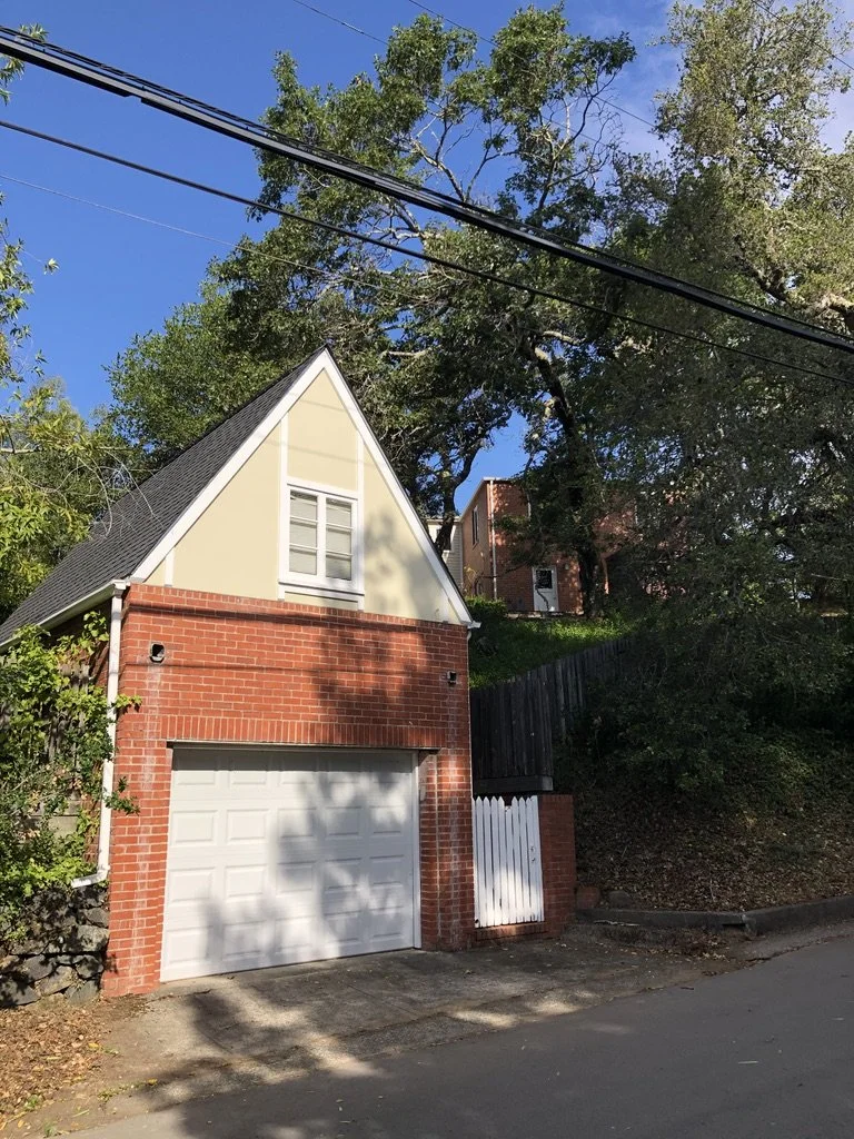  One drain into the flower bed &amp; two directly out onto the driveway.   Murray Park neighborhood of Larkspur, CA. 