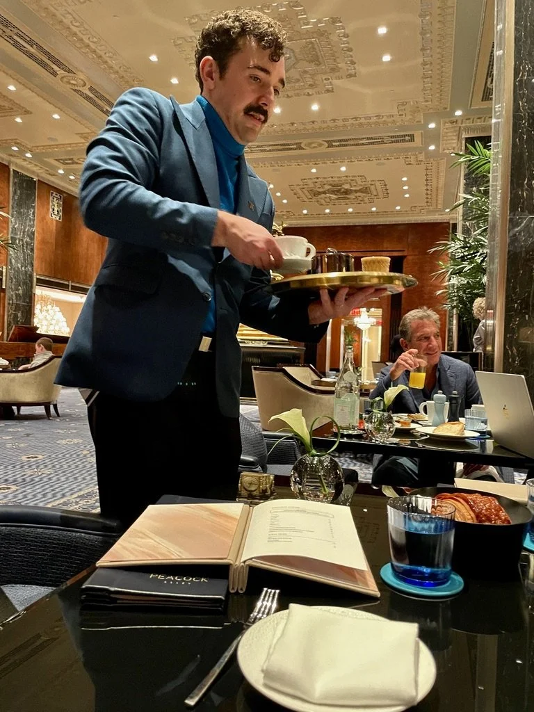  The newly renovated &amp; reopened Waldorf Astoria Hotel for coffee &amp; tour with Noel.  Our waiter is also in theatre.  The fellow with the orange juice owns two restaurants on Lombard St. in San Francisco (overheard).  The cappuccinos were $16- 