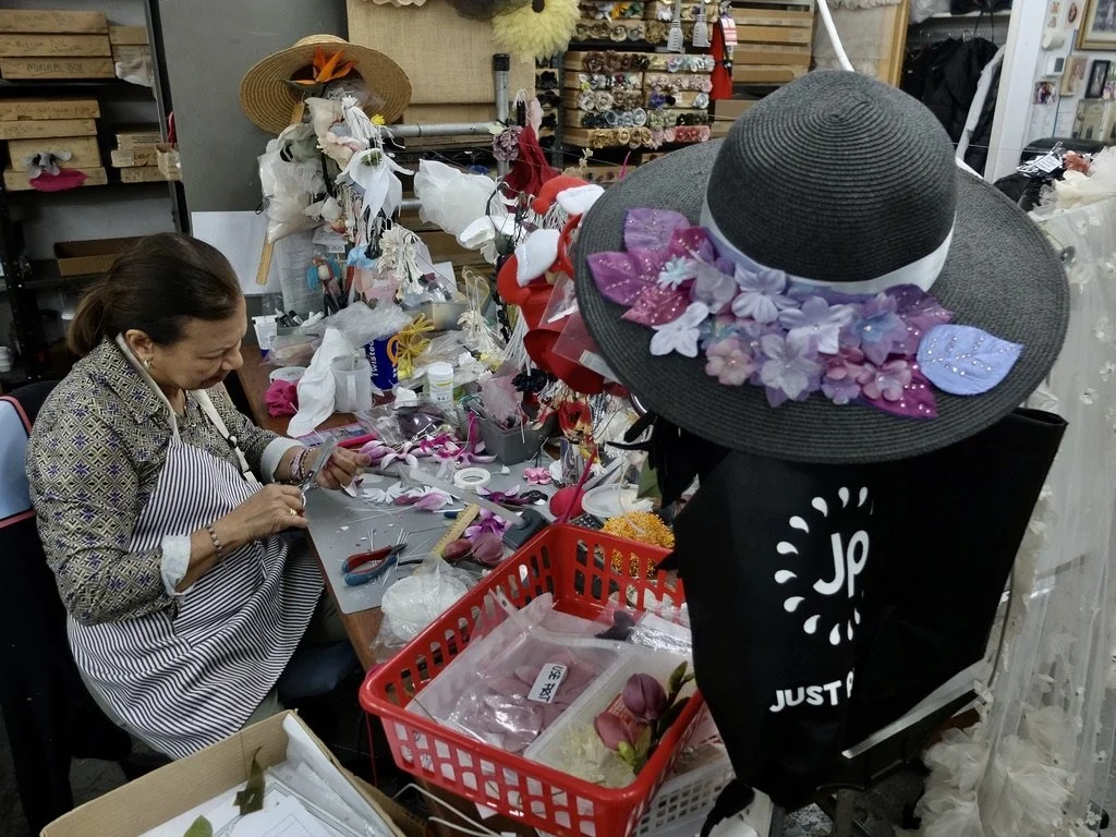   At the start of her career, the union sent her to a factory to learn the trade.  She's since retired but has returned to work.  M &amp; S Schmalberg Custom Fabric Flowers.  