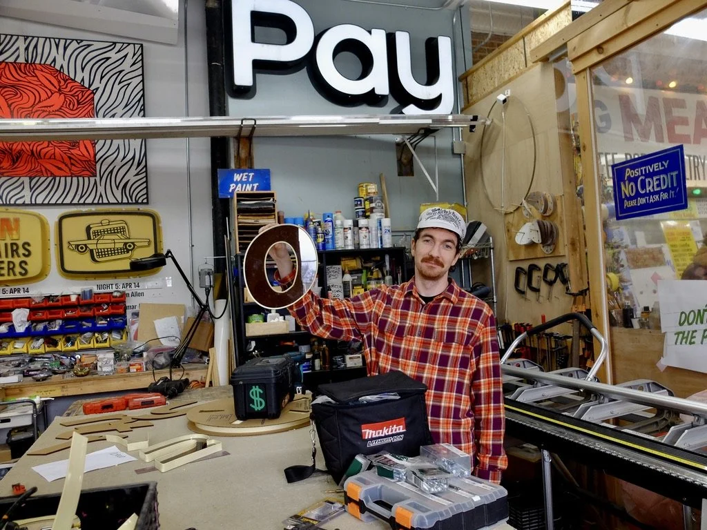  Seamus, along with two other sign makers, gave tours every Friday &amp; Sunday.  It happened by chance as one weekend they had five hundred visitors after being recognized at a conference.  The funds generated by the tours help them to purchase, mai