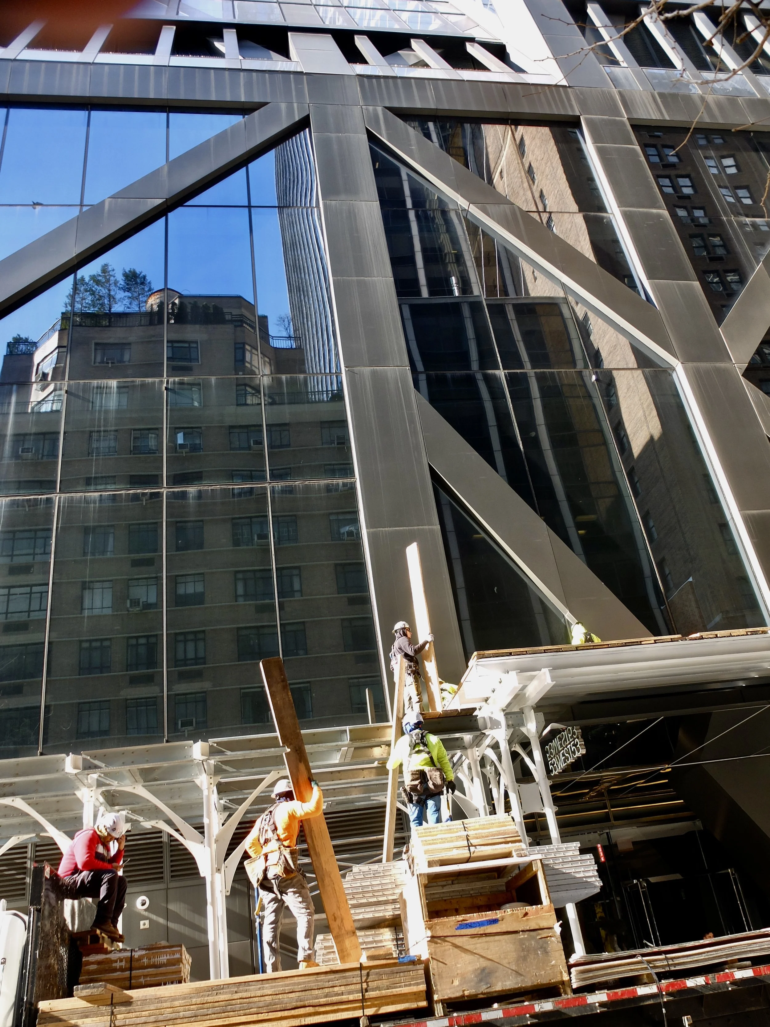 The workers who erect this scaffolding work as a precision team in dangerous conditions. 