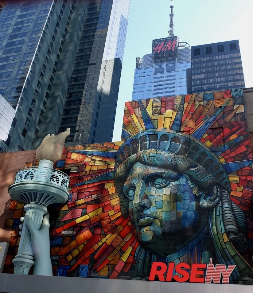  I couldn’t resist this billboard but didn’t take a photo of the few folks in line to enter.  RISENY - "Experience New York like you've never seen before! RiseNY is a 3-part immersive experience in Times Square including a film, museum &amp; soaring 