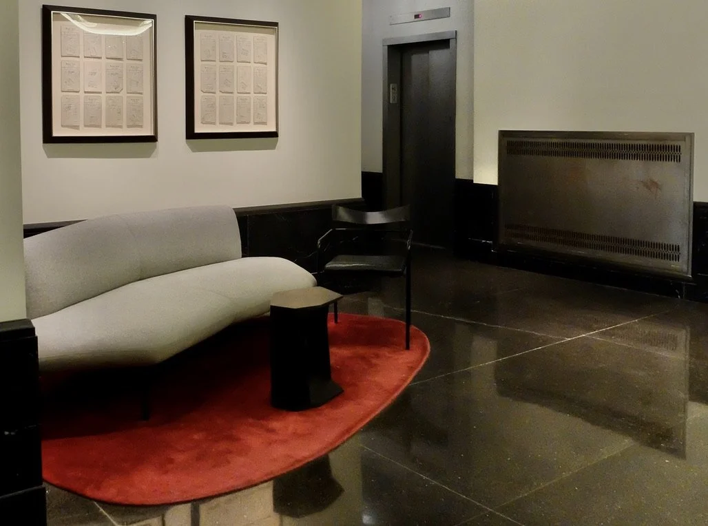  Beaux Arts Apartments lobby with framed receipts from the restaurant that used to be where the gym is now.  