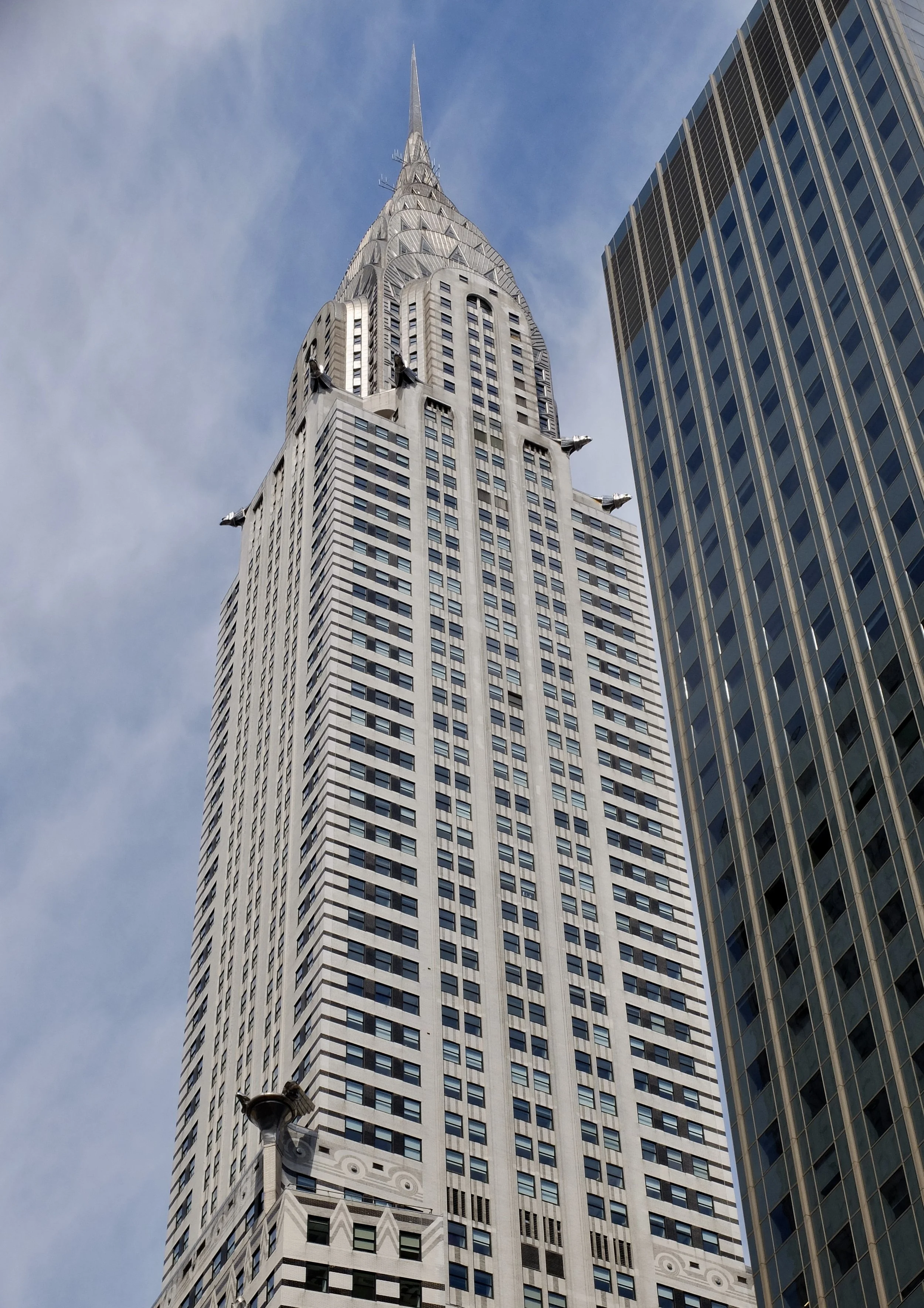  Chrysler Building. " It was both the world's first supertall skyscraper and the world's tallest building for 11 months after its completion in 1930." (Until the Empire State Building was completed). 