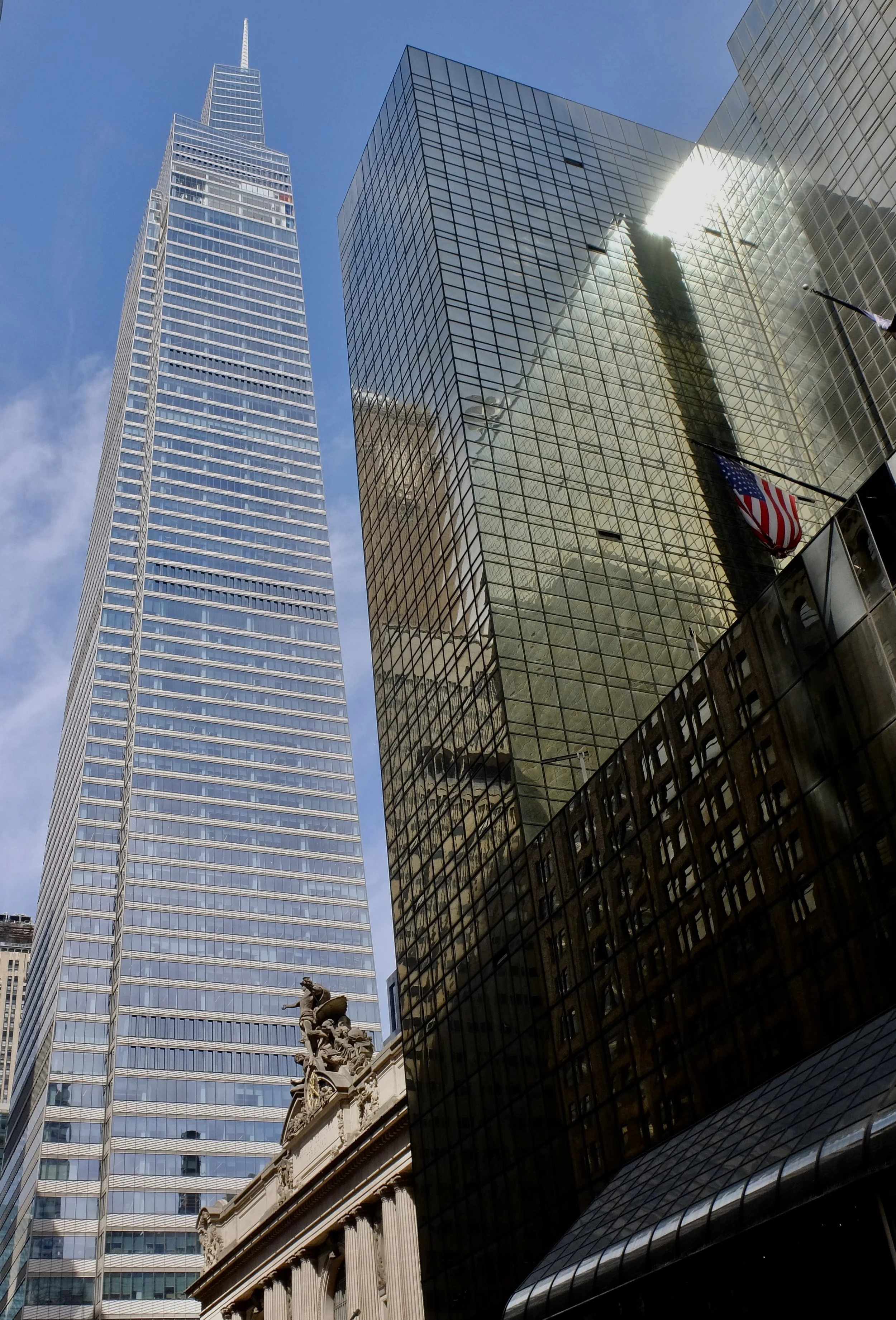  On the left, “One Vanderbilt is a 62-story  supertall  skyscraper…the city's  fourth-tallest building …” “The building opened in September 2020, followed by the observation deck 13 months later.” ($44-149-)  "One Vanderbilt has quickly staked its cl